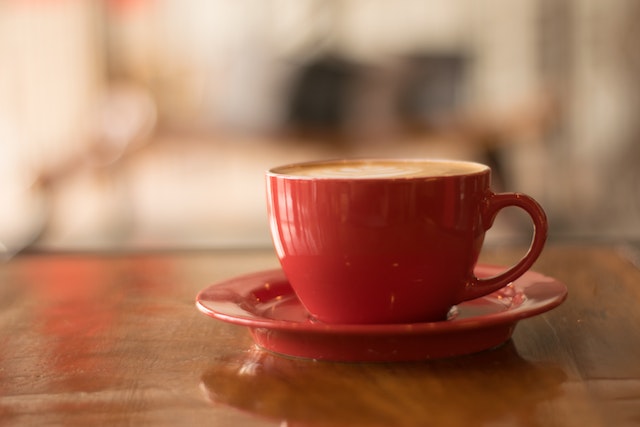 cup of tea in cafe (https://www.pexels.com/photo/red-ceramic-mug-on-red-saucer-1187317/)